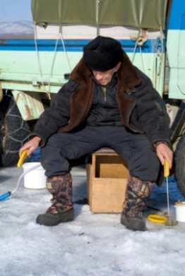 Ice Fishing Concentration With Two Rods